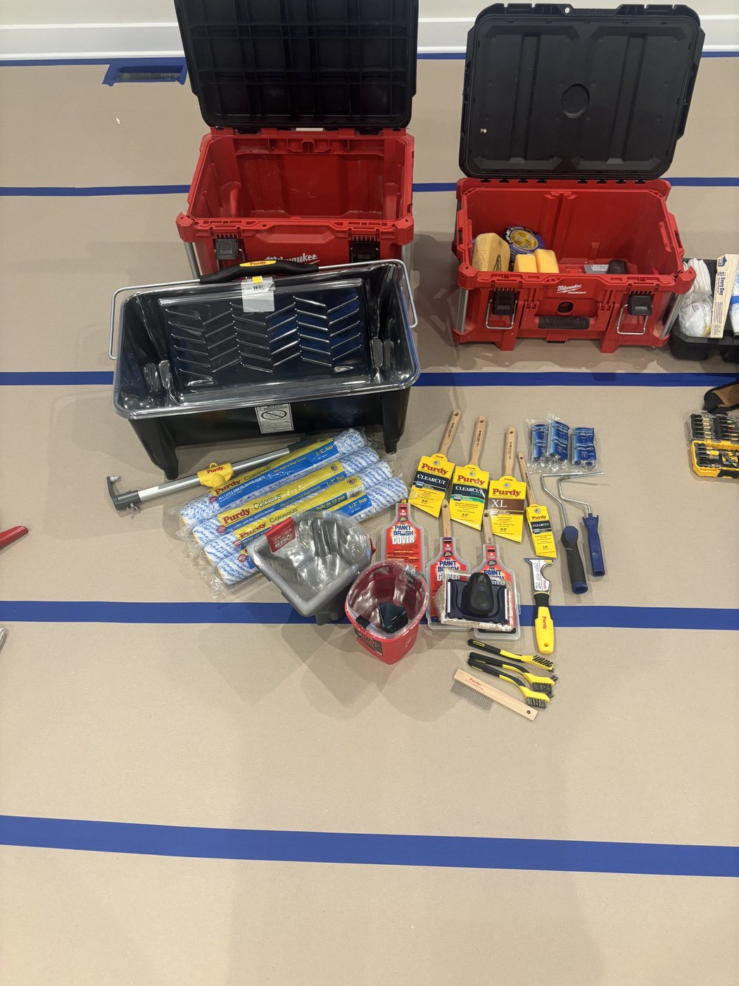 Rollers, brushes, and prep tools ready for a job